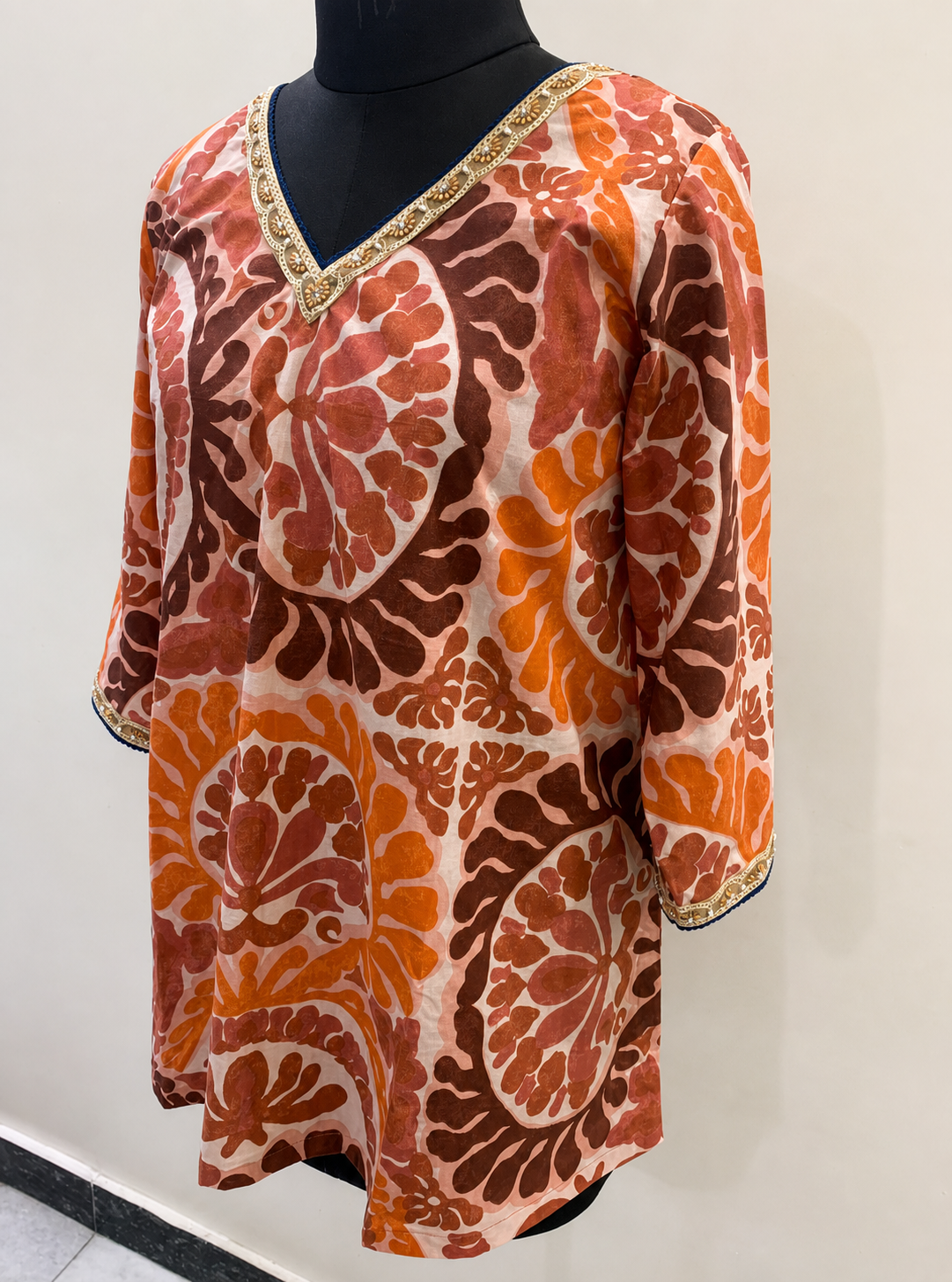 Women’s Rust Orange Printed Straight Kurti with Embellished Neckline