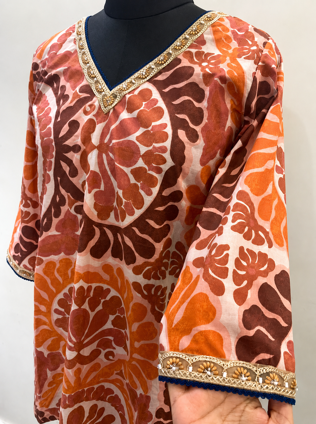 Women’s Rust Orange Printed Straight Kurti with Embellished Neckline