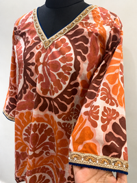 Women’s Rust Orange Printed Straight Kurti with Embellished Neckline